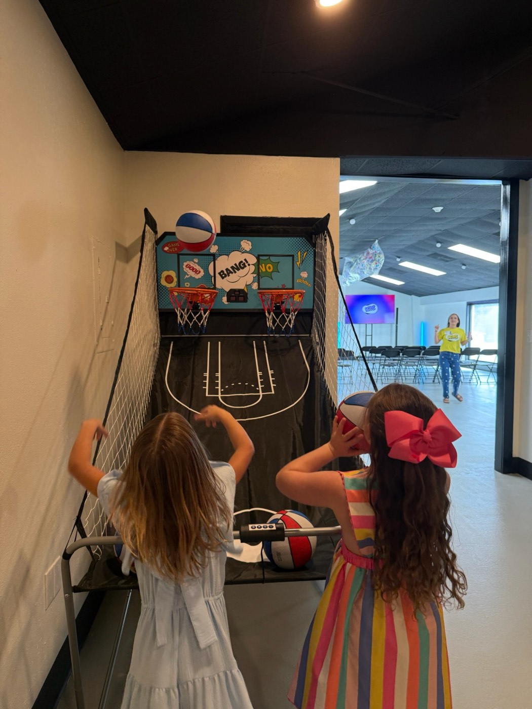 Kids playing basketball in the Loft game room