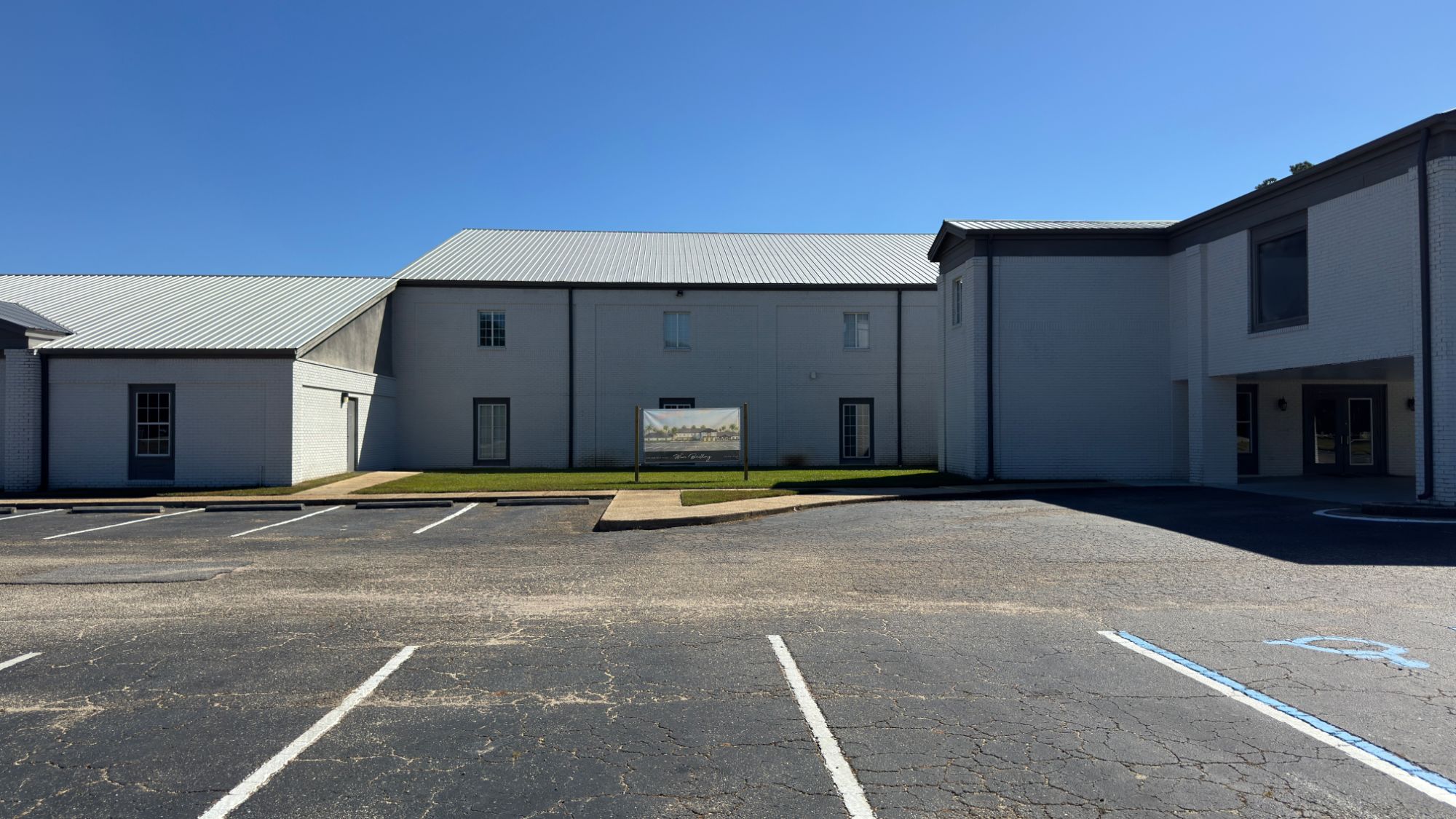 The empty grass courtyard between the two wings