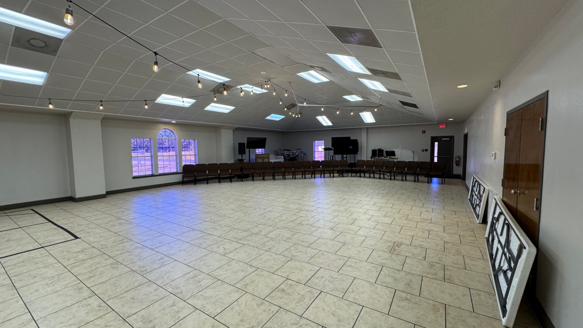 The Event Center with fluorescent lights and tile floor