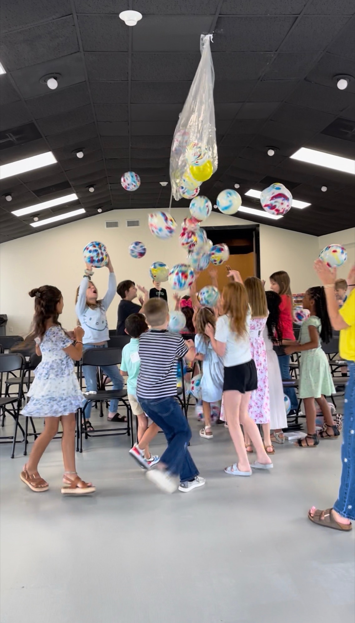 Kids celebrating a balloon drop in kids ministry