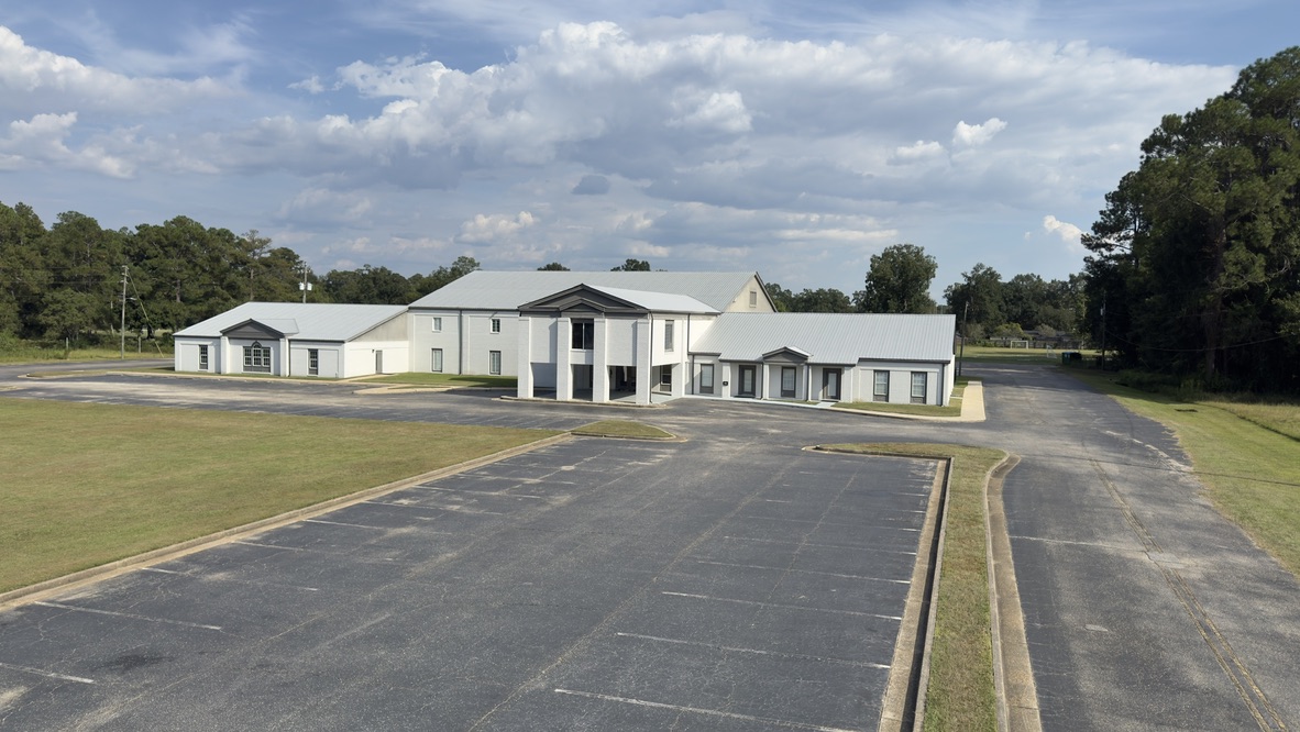 Aerial view of the cracked front parking lot and the church building
