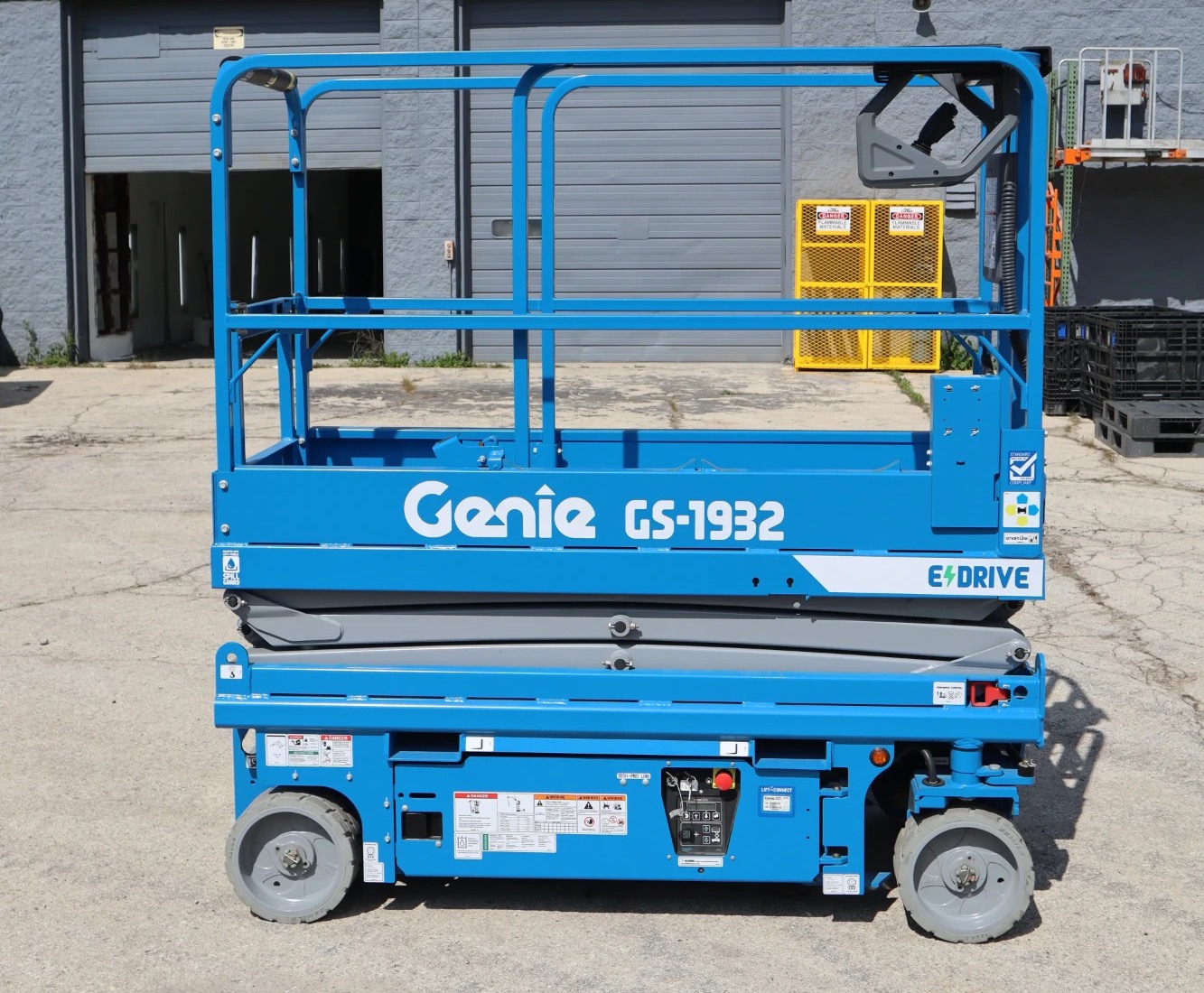 A blue electric scissor lift