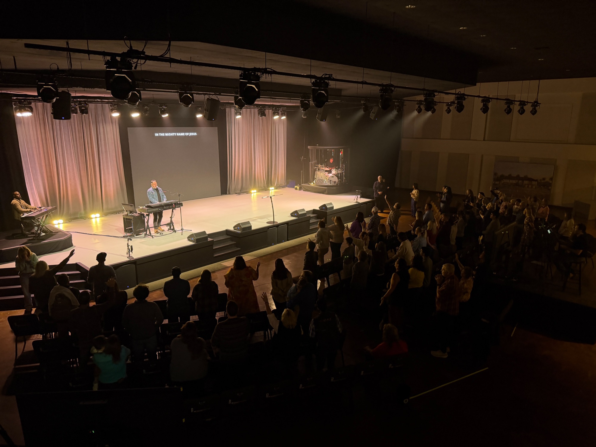 Sunday worship seen from the back of the auditorium